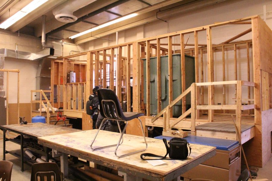 The plumbing workshop is located in room 1503. The structure built in the photo is where the students do most of their work. It contains a first floor plan with a bathroom being the main focus.