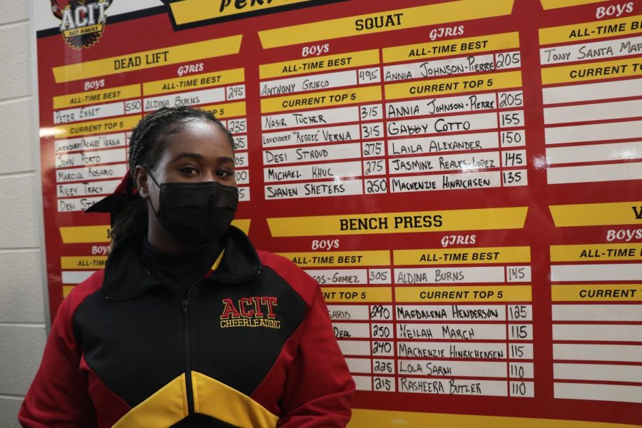 Johnson-Pierre+stands+by+the+Performance+Board+that+now+includes+her+latest+record+for+squats.
