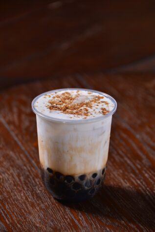 Brown boba on a wooden table.